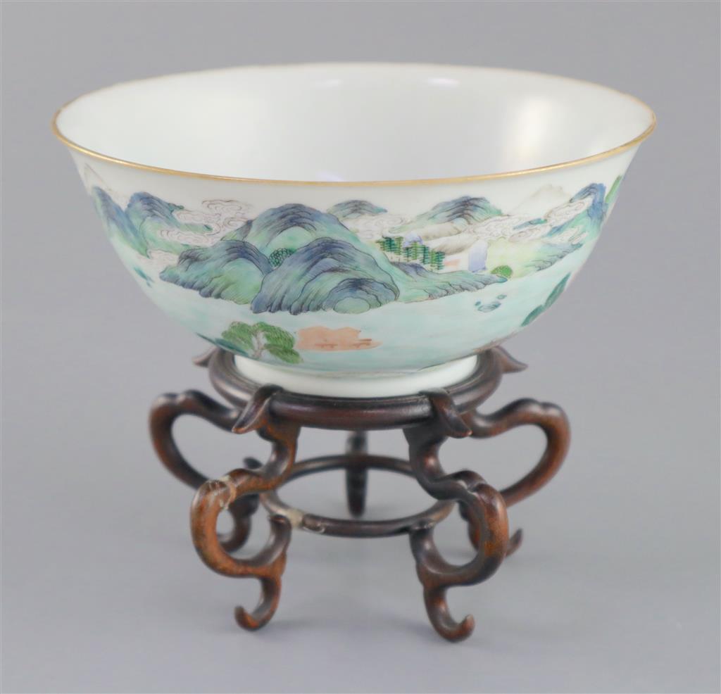 A Chinese enamelled landscape porcelain bowl, Jiaqing mark and of the period (1796-1820), 15.5cm diameter, wood stand